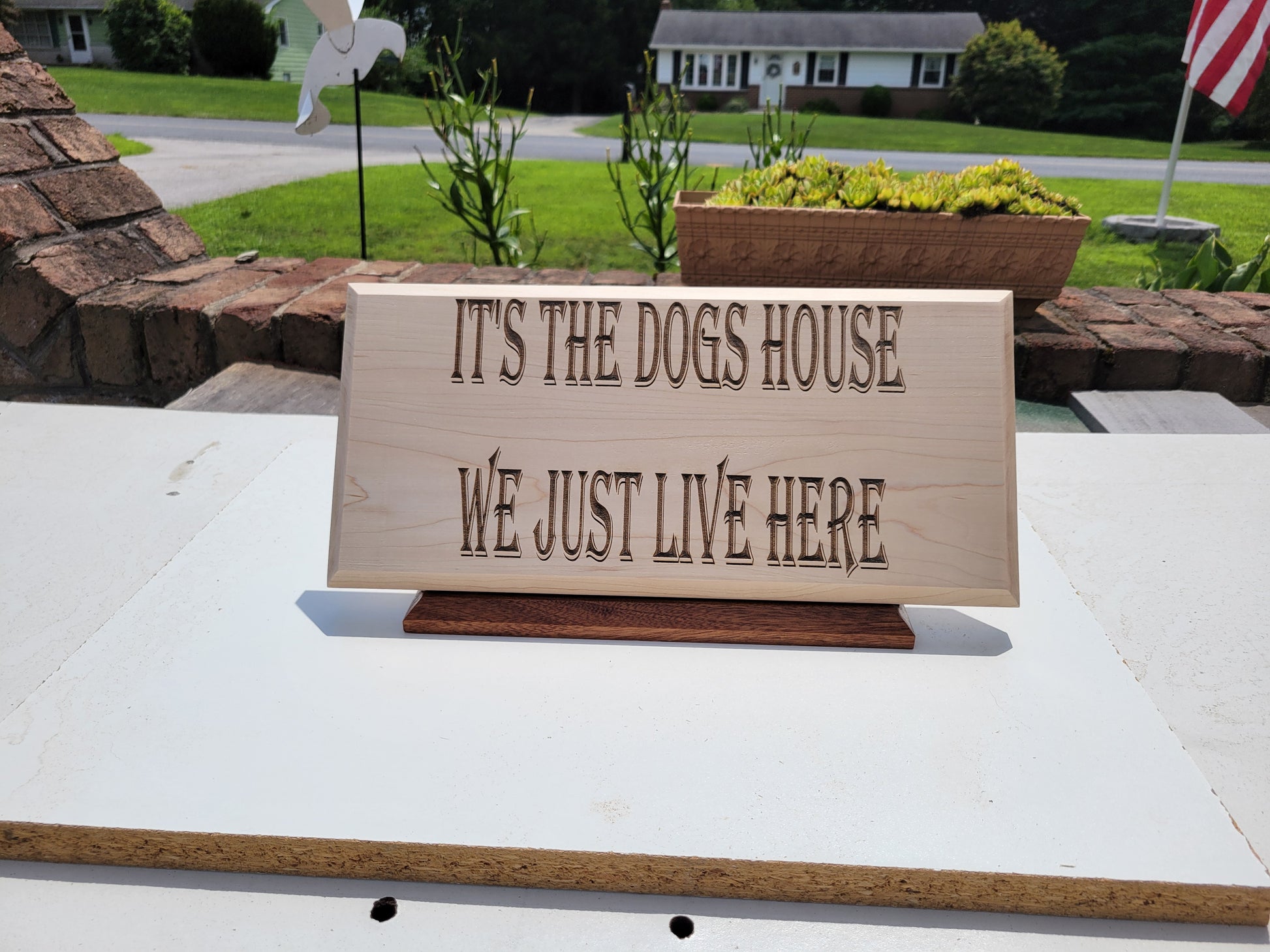 IT'S THE DOGS HOUSE WE JUST LIVE HERE