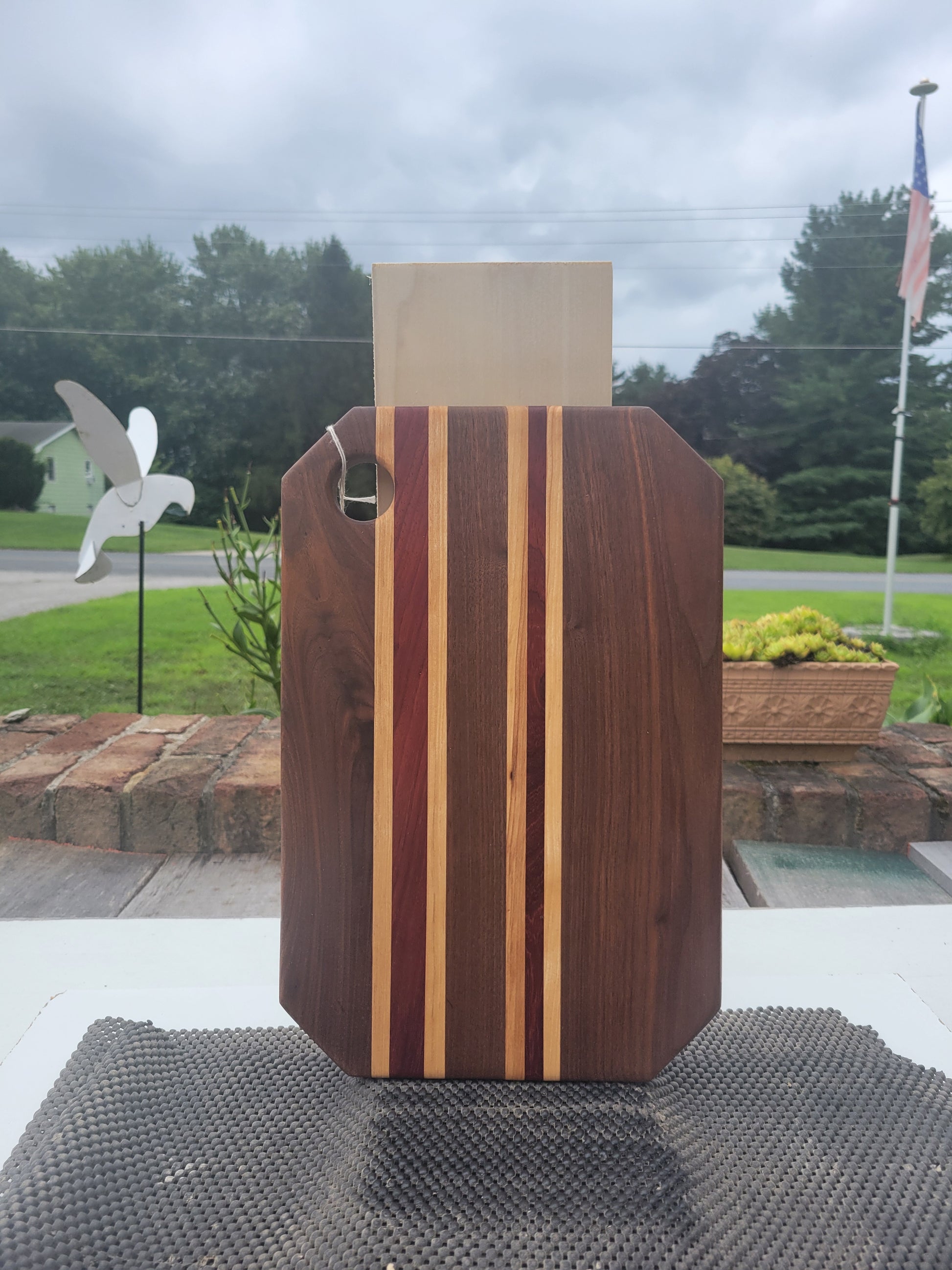 Walnut Charcuterie Board with strips of Padauk and Maple
